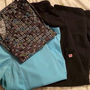 2 scrub tops and 1 bottom